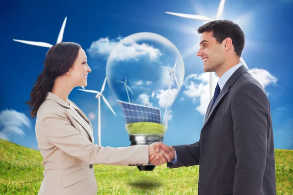 Composite image of future partners shaking hands — Stock Photo, Image