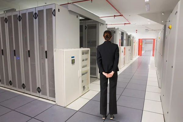Business woman against data center — стоковое фото