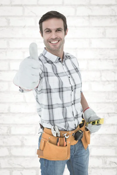 Happy handyman gesturing thumbs up — Stock Photo, Image