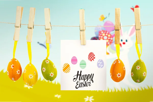 Happy easter graphic against bunny with eggs — Stock Photo, Image
