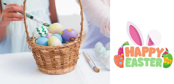 Mother and daughter painting easter eggs — Stock Photo, Image