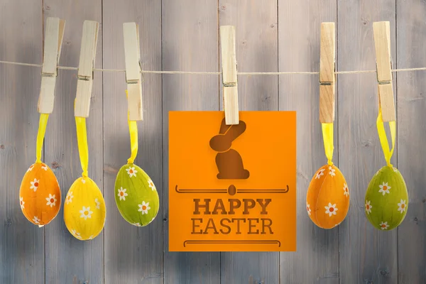 Happy easter graphic against wooden planks — Stock Photo, Image