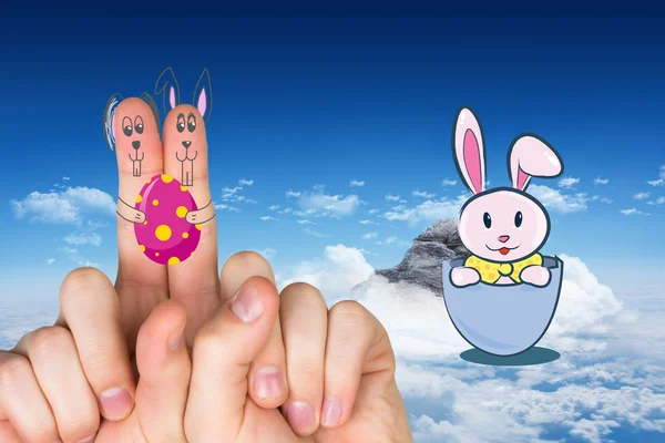 Fingers as easter bunny against mountain peak — Stock Photo, Image