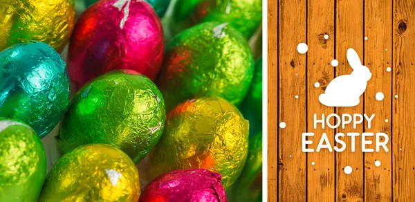 Feliz gráfico de Pascua contra tablones de madera — Foto de Stock