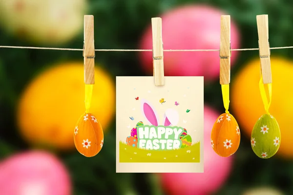 Happy easter graphic against easter eggs — Stock Photo, Image