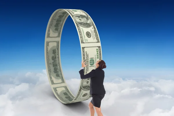 Businesswoman and banknotes against sky — Stock Photo, Image