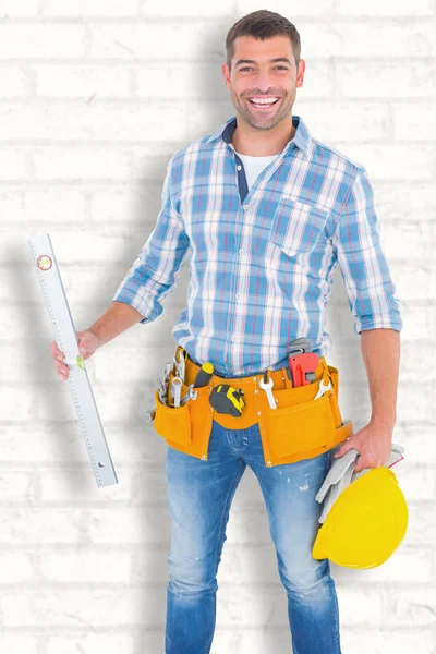 Manual worker holding spirit level — Stock Photo, Image