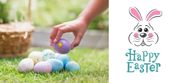 Little girl collecting easter eggs — Stock Photo, Image