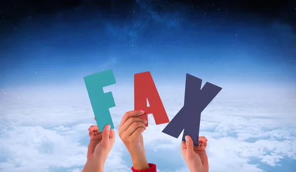 Hands holding up fax against white clouds — Stock Photo, Image