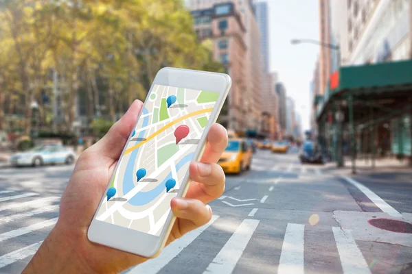 Composite image of man using map app on phone — Stock Photo, Image