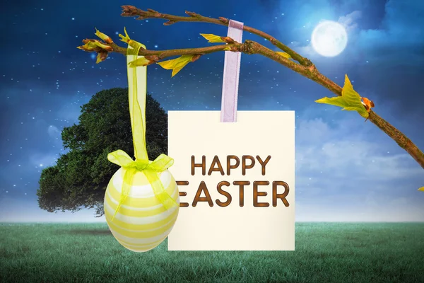 Happy Easter groet tegen boom in veld — Stockfoto