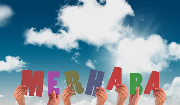 Hands holding up merhaba against blue sky — Stock Photo, Image