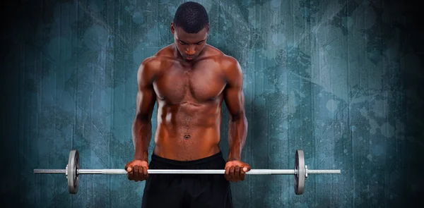 Homem apto levantando barbell — Fotografia de Stock