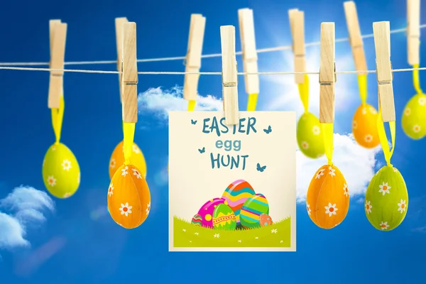 Easter  eggs hunt graphic against blue sky — Stock Photo, Image