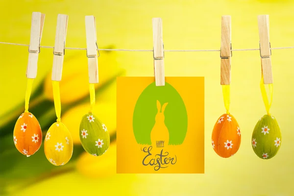 Happy easter graphic against tulips — Stock Photo, Image