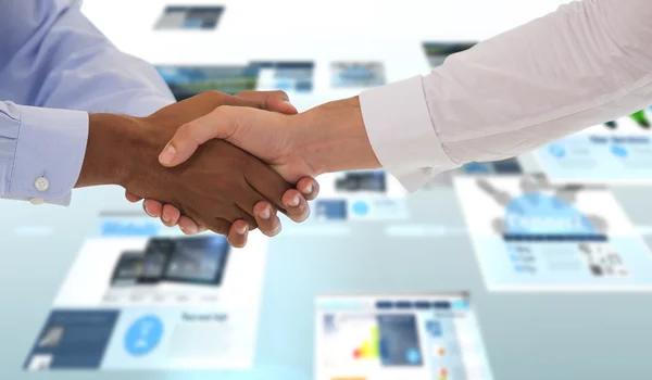 Shot of a handshake in office — Stock Photo, Image