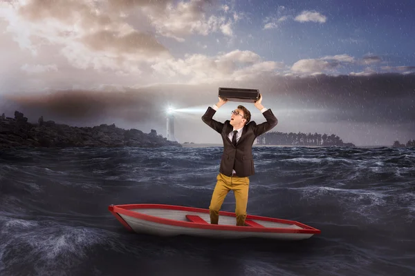 Businessman in boat against stormy sea — Stock Photo, Image