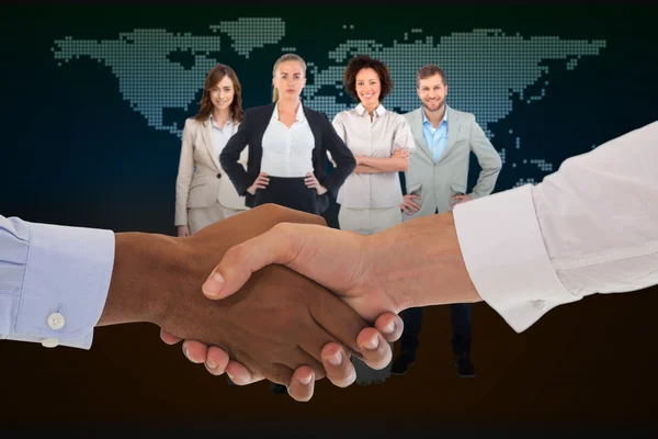 Composite image of close-up shot of a handshake in office — Stock Photo, Image