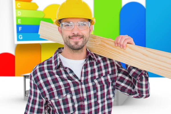Handyman holding wood planks — Stock Photo, Image