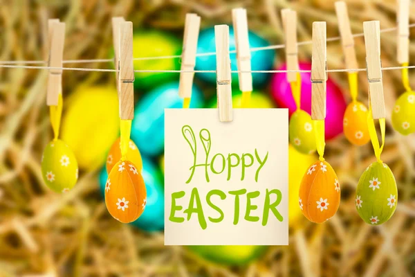 Happy easter graphic against easter eggs — Stock Photo, Image