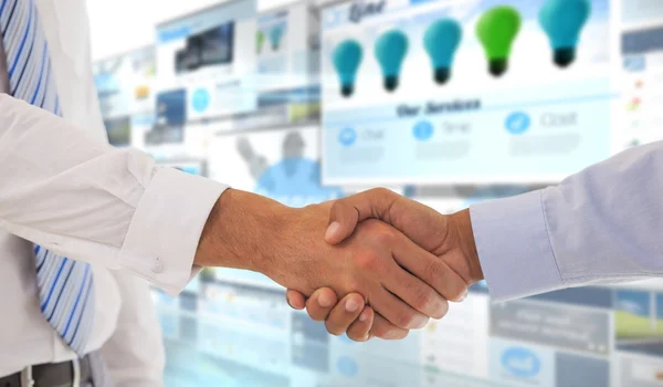 Shot of a handshake in office — Stock Photo, Image