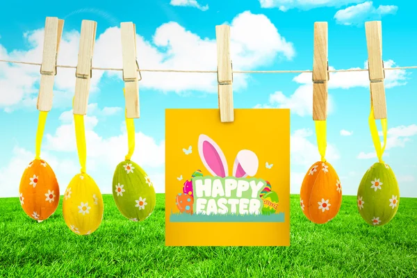 Happy easter graphic against field and sky — Stock Photo, Image