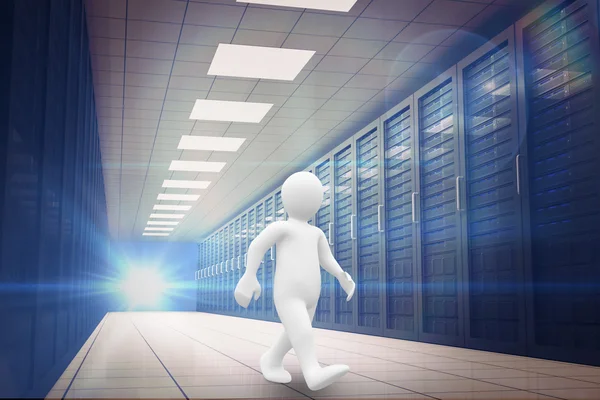 White character walking against server room — Stock Photo, Image