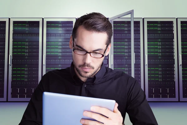 Businessman in glasses using tablet — Stock Photo, Image