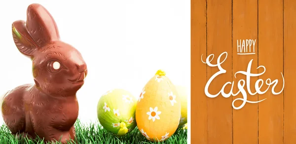 Happy easter graphic against wooden planks — Stock Photo, Image