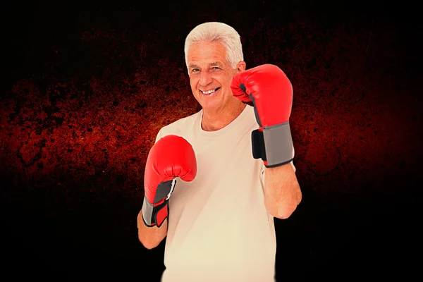 Senior man in boxing gloves — Stock Photo, Image