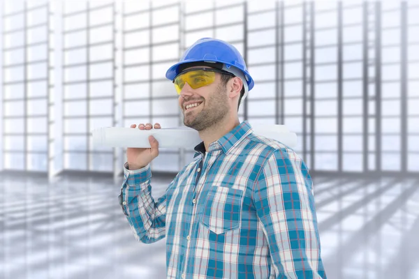 Imagem composta de arquiteto sorrindo olhando para longe enquanto segurando — Fotografia de Stock