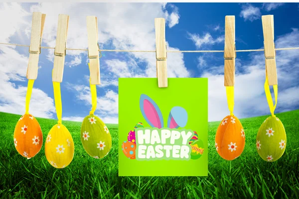 Happy Easter groet tegen groen veld — Stockfoto