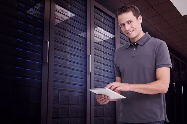 Smiling young man with tablet computer — Stock Photo, Image