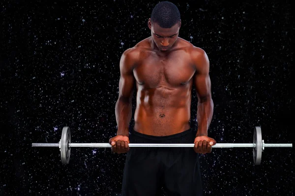 Imagem composta de homem apto levantando barbell — Fotografia de Stock