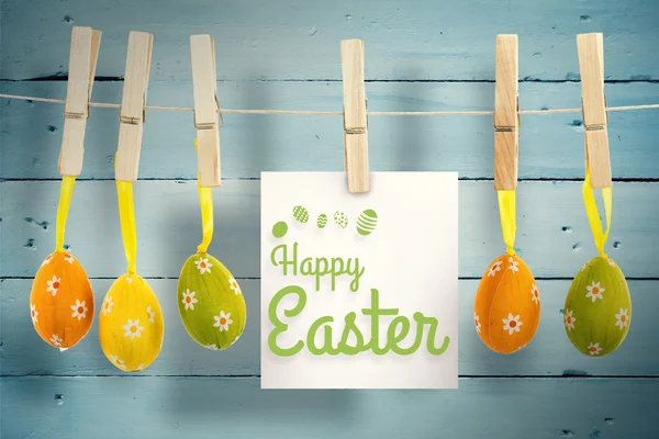 Happy Easter greeting against wooden planks — Stock Photo, Image