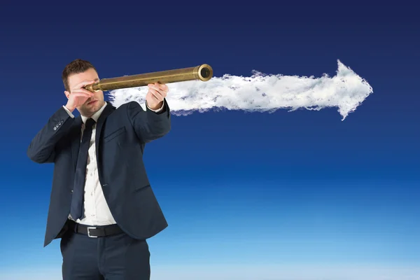 Businessman looking through telescope — Stock Photo, Image