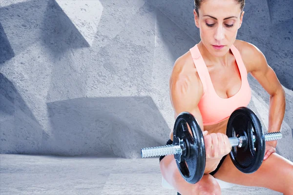 Woman doing bicep curl with dumbbell — Stock Photo, Image