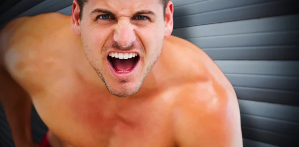 Strong muscular bodybuilder shouting — Stock Photo, Image