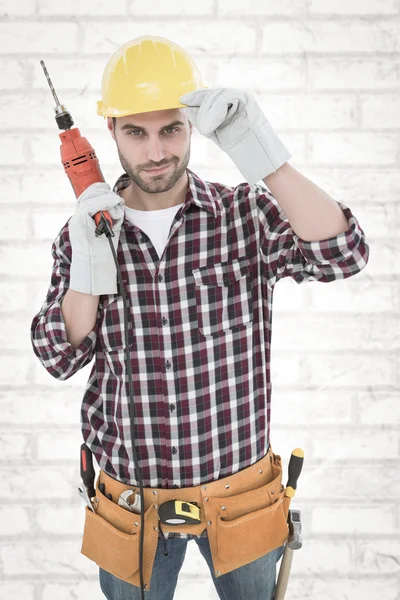 Confident handyman holding drill machine — Stock Photo, Image