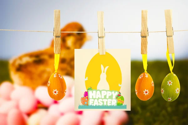Happy easter graphic against easter eggs — Stock Photo, Image
