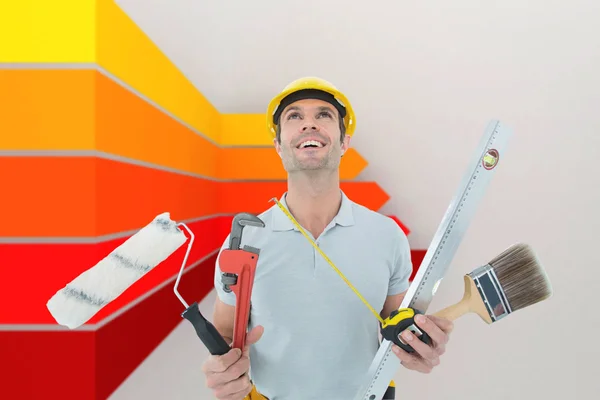 Worker holding various equipment — Stock Photo, Image