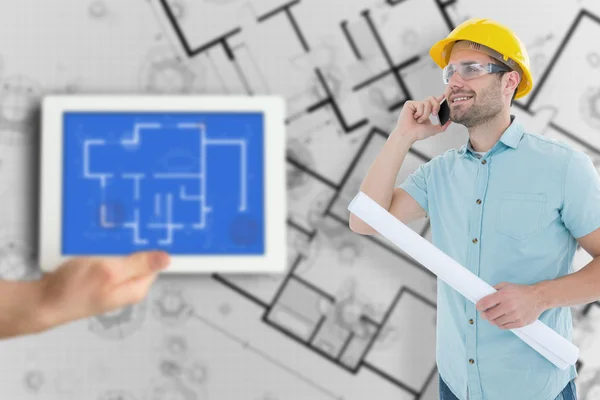 Architect with blueprint talking on mobile phone — Stock Photo, Image