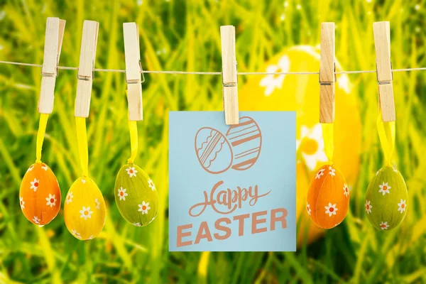 Feliz Pascua gráfica contra el huevo de naranja —  Fotos de Stock