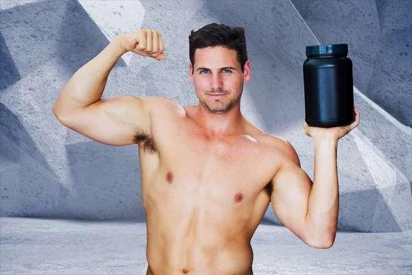 Bodybuilder with protein powder — Stock Photo, Image