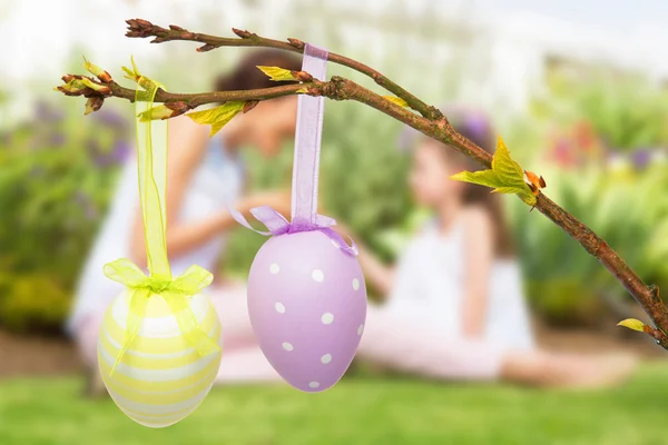 Mother and daughter collecting easter eggs Royalty Free Stock Images
