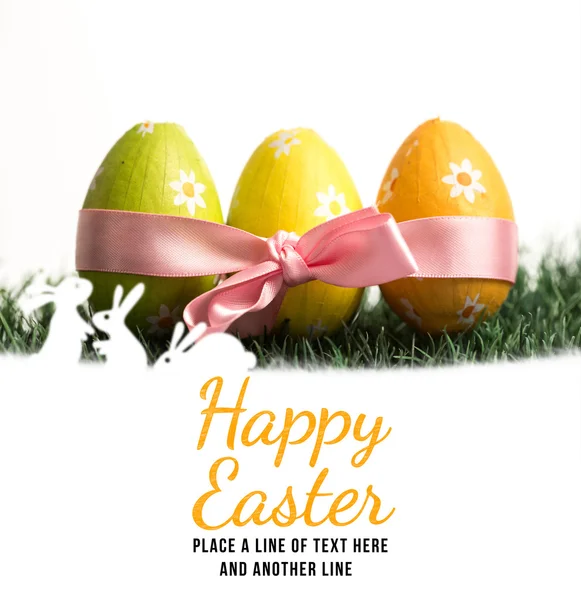 Happy easter against eggs with ribbon Royalty Free Stock Images