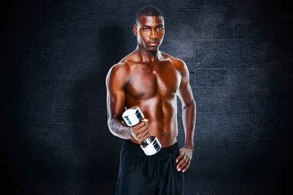 Composite image of portrait of a fit shirtless young man lifting — Stock Photo, Image