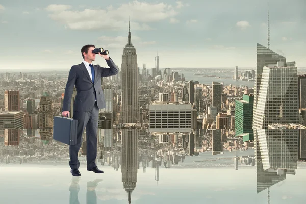 Businessman looking through binoculars — Stock Photo, Image