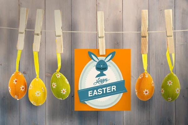 Happy Easter greeting against wooden planks — Stock Photo, Image