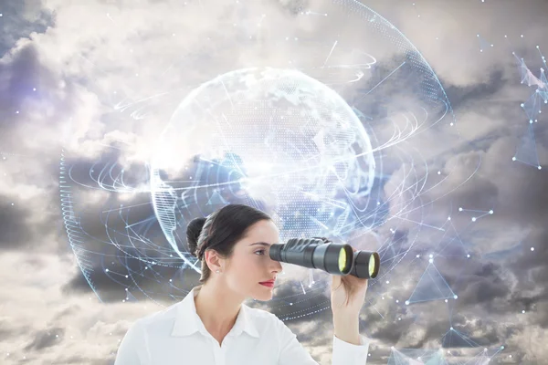 Business woman looking through binoculars — Stock Photo, Image